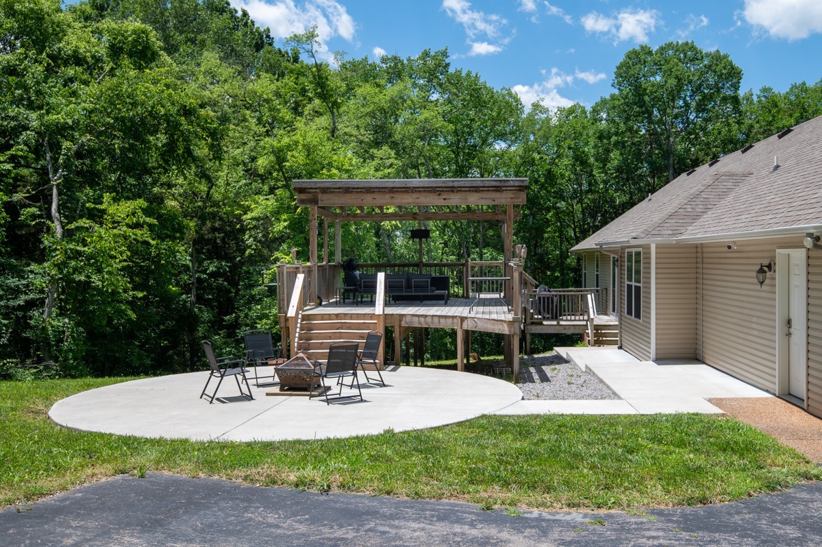 1555 Heller Ridge Spring Hill, TN 37174 - Photo 31 of 50 a view of a house with backyard porch and sitting area