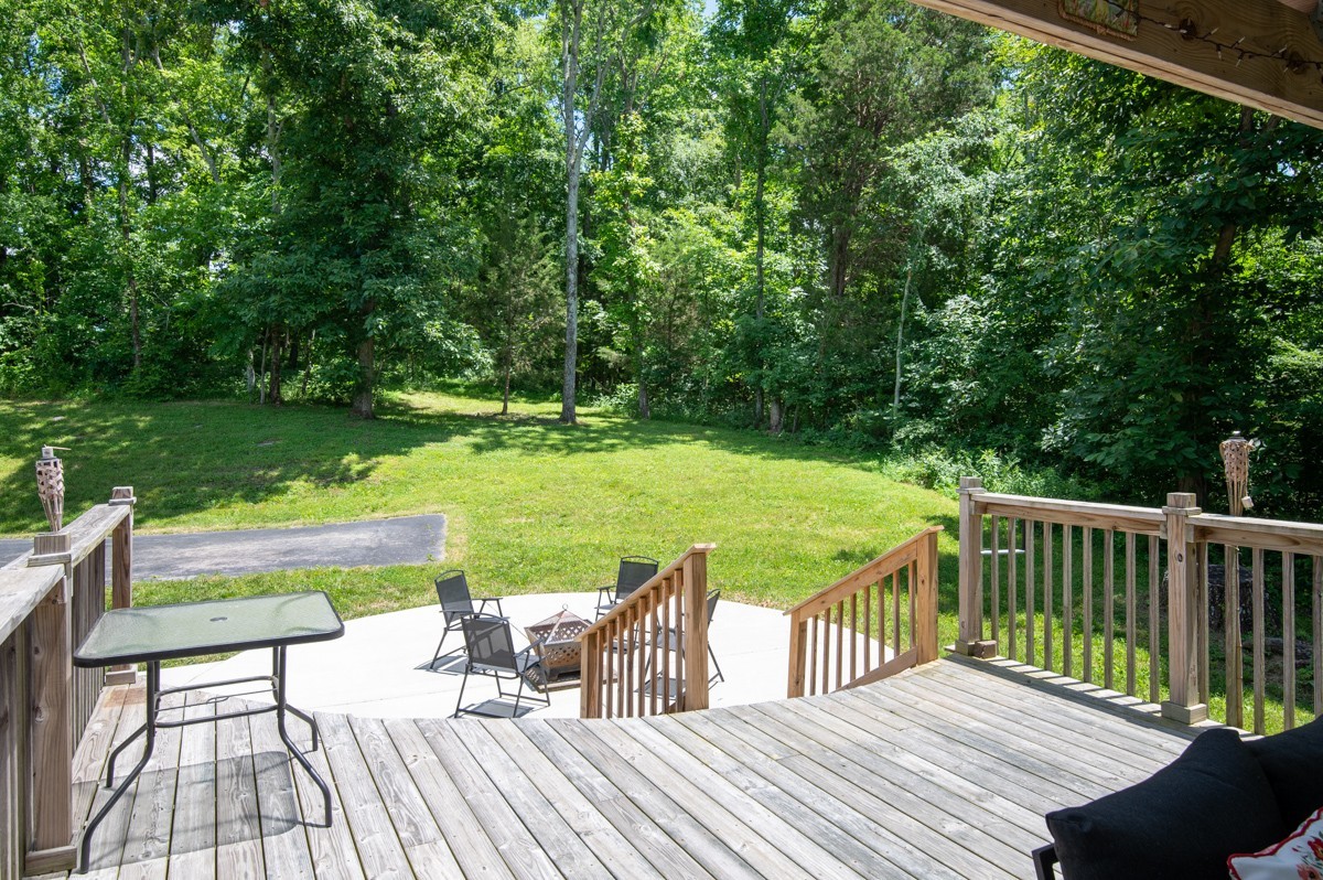 1555 Heller Ridge Spring Hill, TN 37174 - Photo 35 of 50 a view of a deck with chairs and a yard