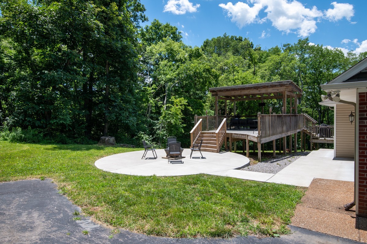 1555 Heller Ridge Spring Hill, TN 37174 - Photo 36 of 50 a view of house with backyard and outdoor seating