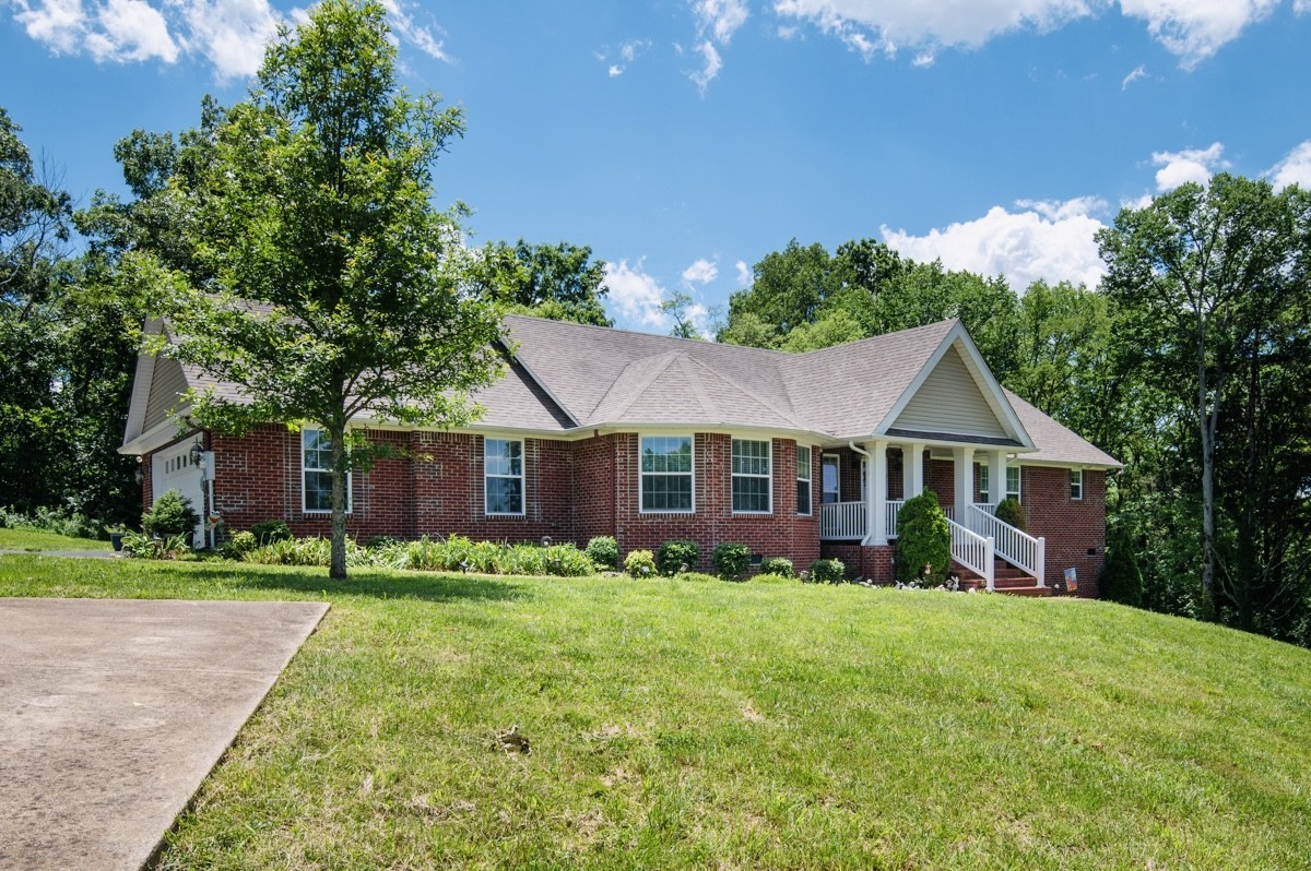 1555 Heller Ridge Spring Hill, TN 37174 - Photo 49 of 50 a front view of a house with garden