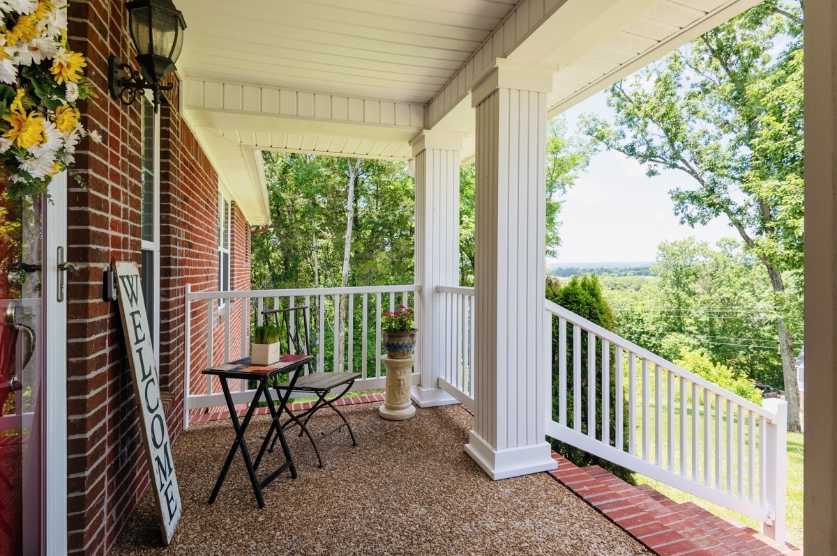 1555 Heller Ridge Spring Hill, TN 37174 - Photo 6 of 50 a view of a chair and table in the balcony