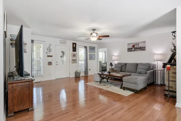 a living room with furniture and a flat screen tv