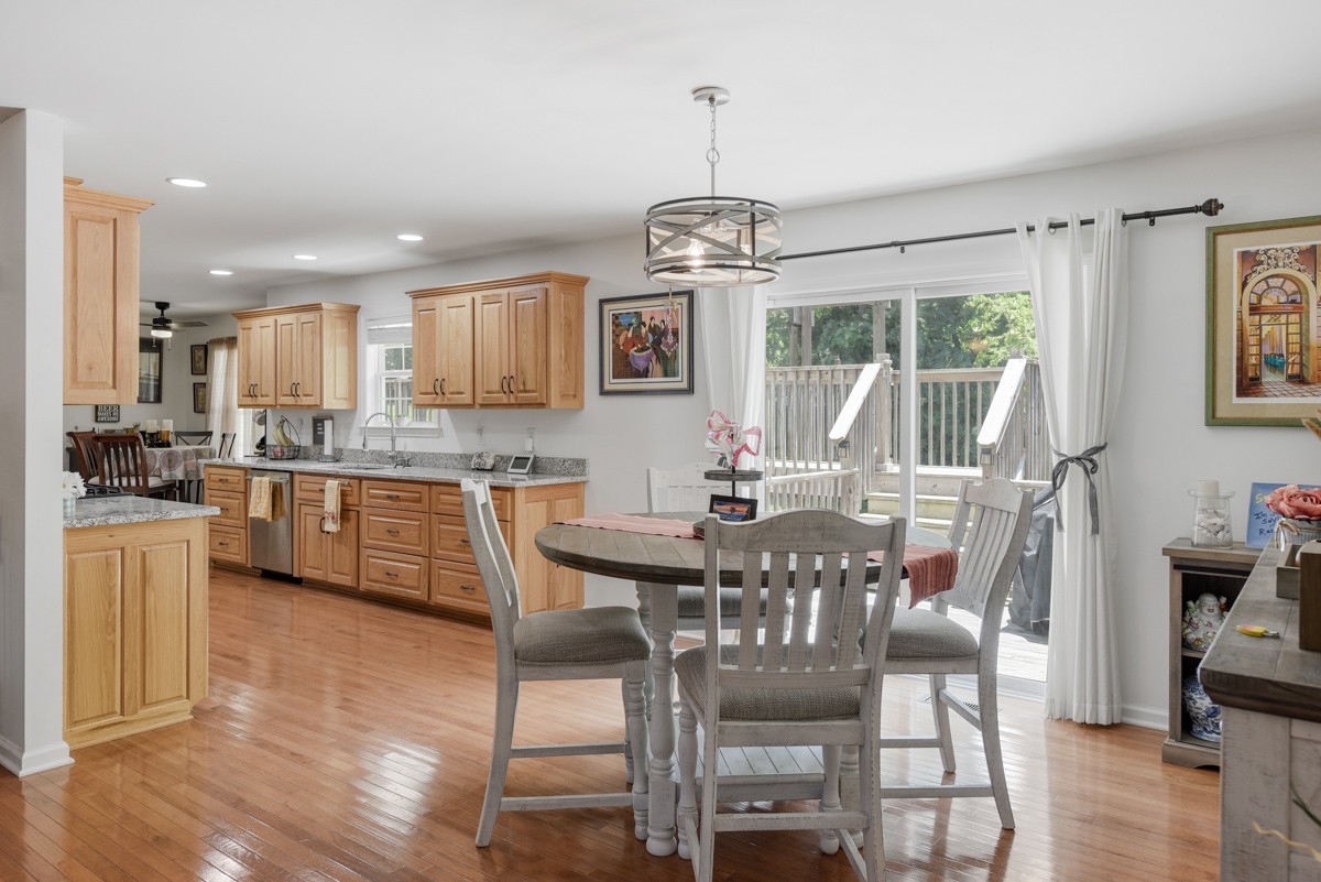 1555 Heller Ridge Spring Hill, TN 37174 - Photo 10 of 50 a view of a dining room with furniture window and wooden floor