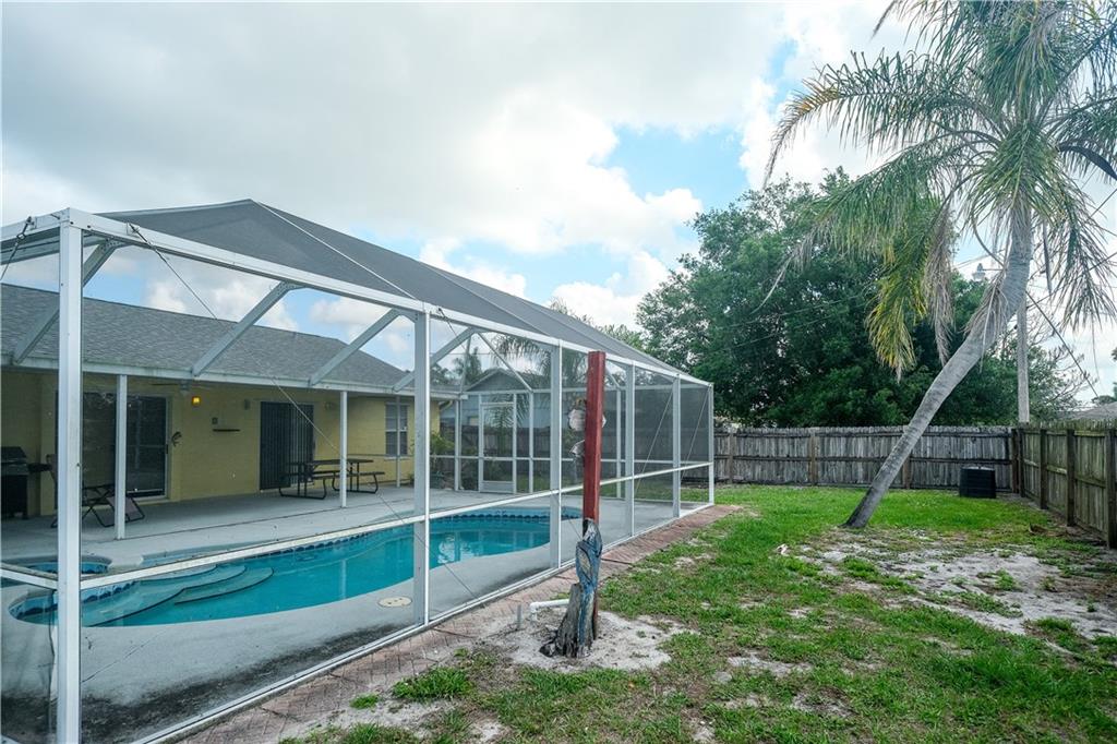 842 Southwest Commonwealth Road Port St. Lucie, FL 34953 - Photo 17 of 36 a view of a backyard with a garden