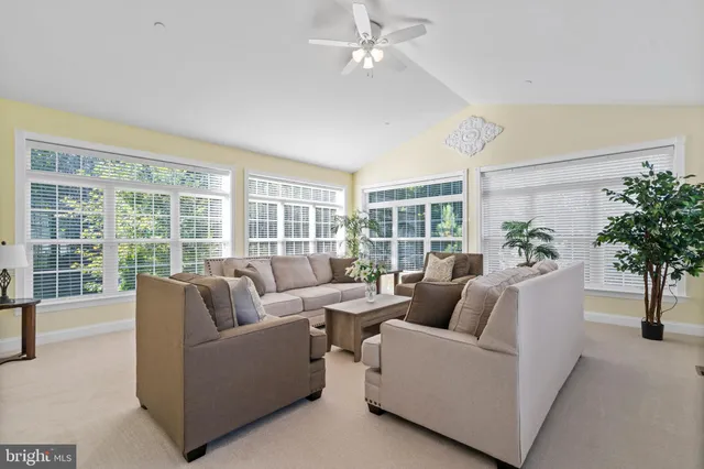 a spacious bathroom with a tub double sink and a mirror