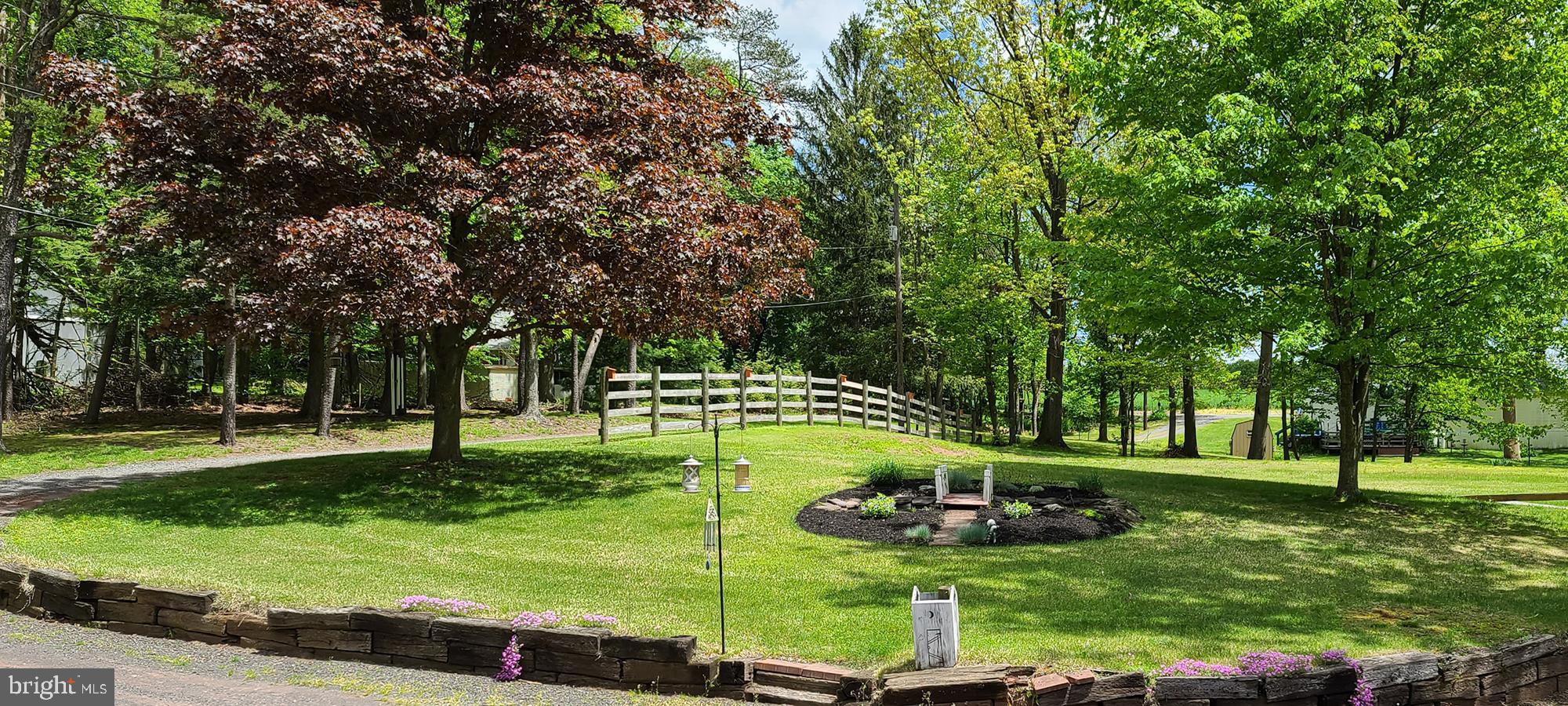 681 Turkey Bird Road Newport, PA 17074 - Photo 17 of 19 Beautiful landscaping with small pond