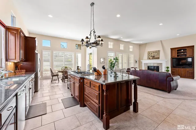 a view of a living room and kitchen center island
