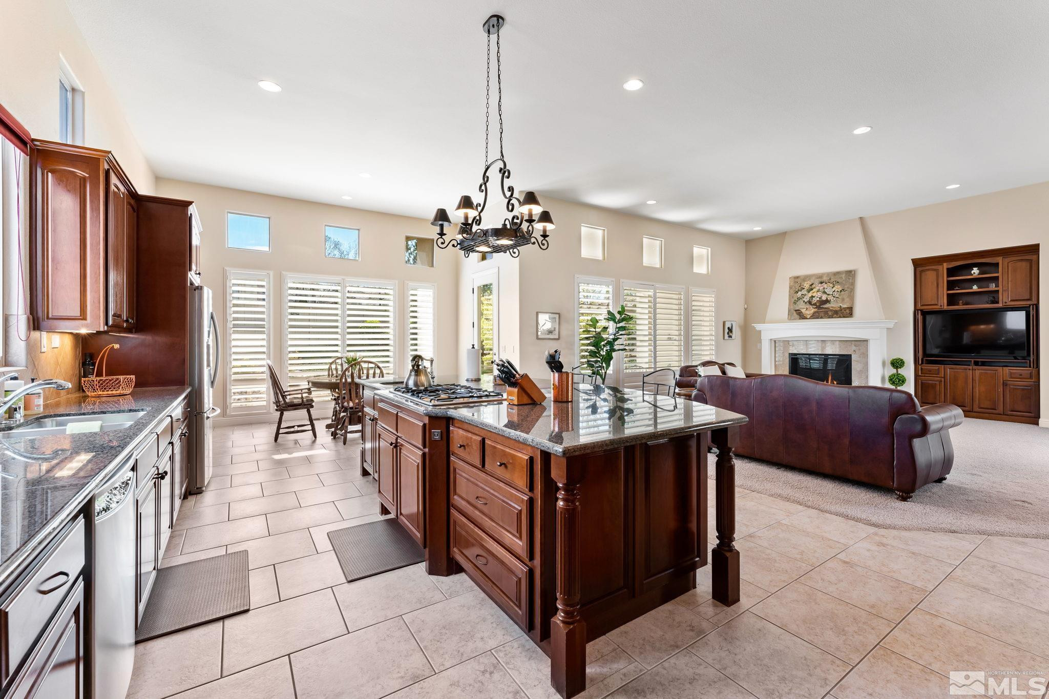 13395 Damonte View Lane Reno, NV 89511 - Photo 13 of 40 a kitchen with stainless steel appliances granite countertop a stove a sink dishwasher and a refrigerator