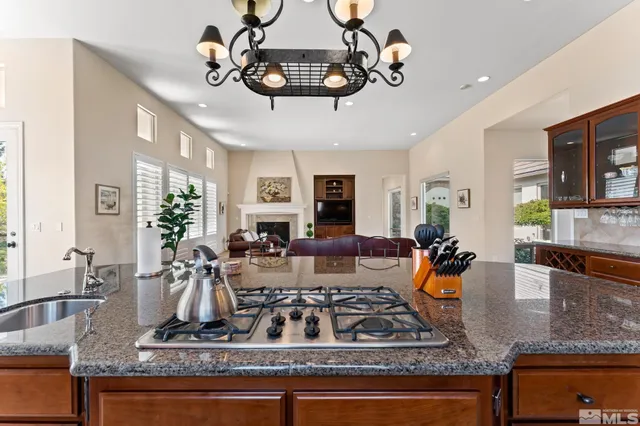 a view of living room kitchen with stainless steel appliances