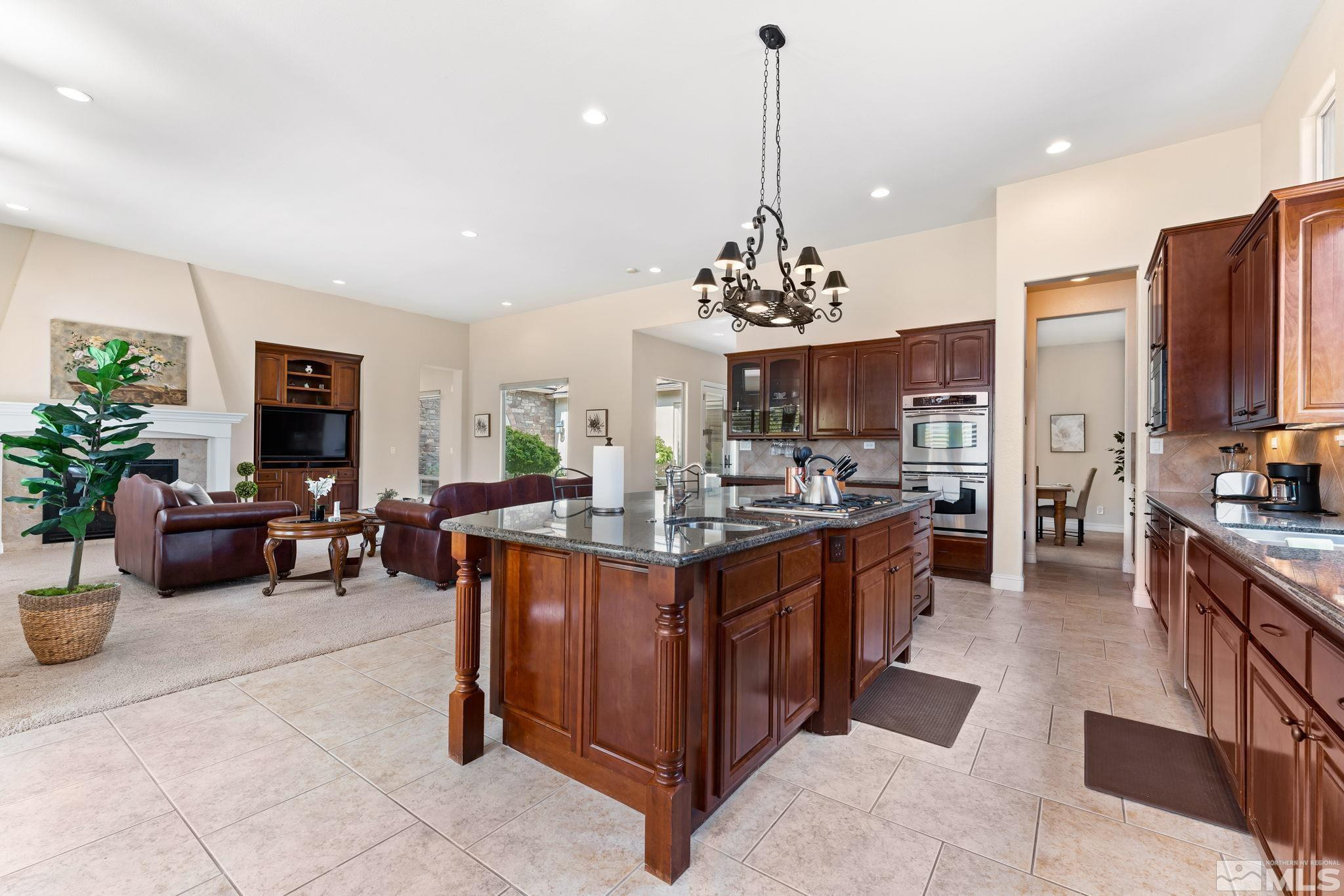 13395 Damonte View Lane Reno, NV 89511 - Photo 15 of 40 a view of living room kitchen with stainless steel appliances