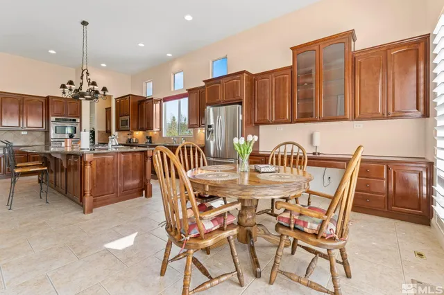 a view of a dining room with furniture and window