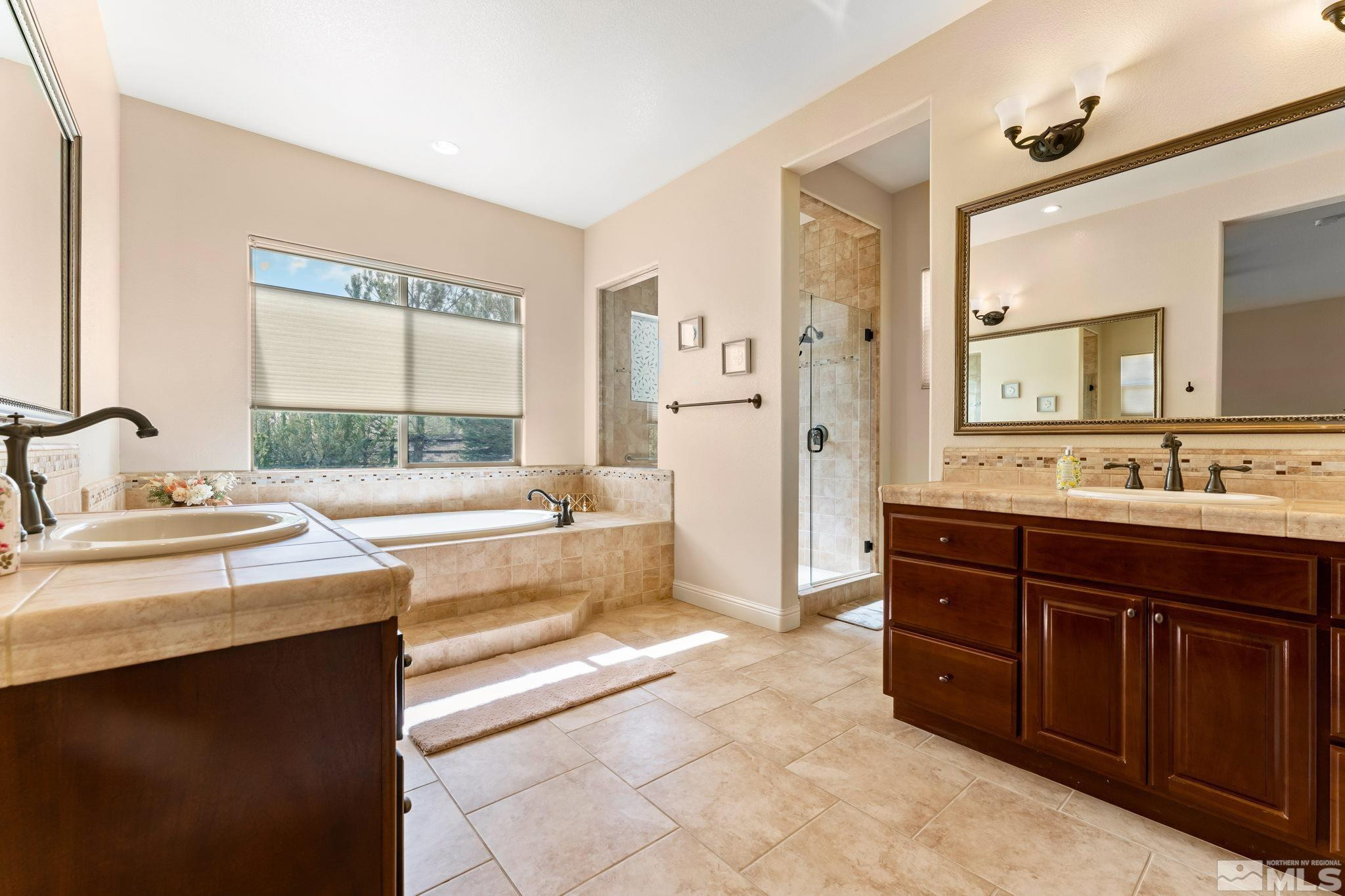13395 Damonte View Lane Reno, NV 89511 - Photo 23 of 40 a spacious bathroom with a tub sink and mirror