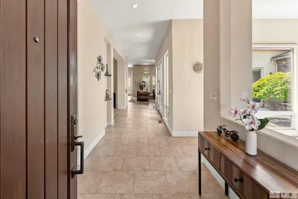 a view of a hallway and dining room