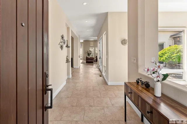 a view of a hallway and dining room
