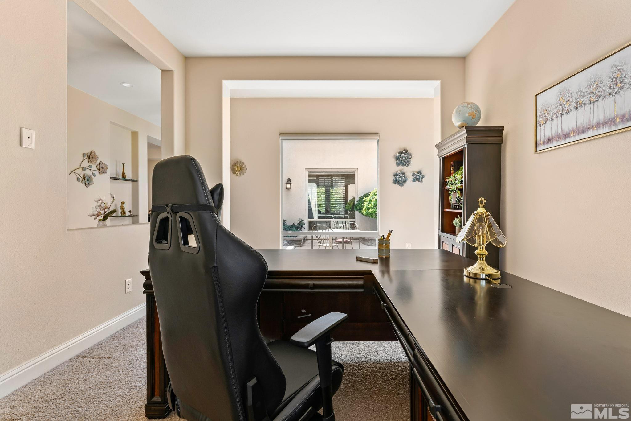 13395 Damonte View Lane Reno, NV 89511 - Photo 31 of 40 a view of a workspace with furniture and a potted plant