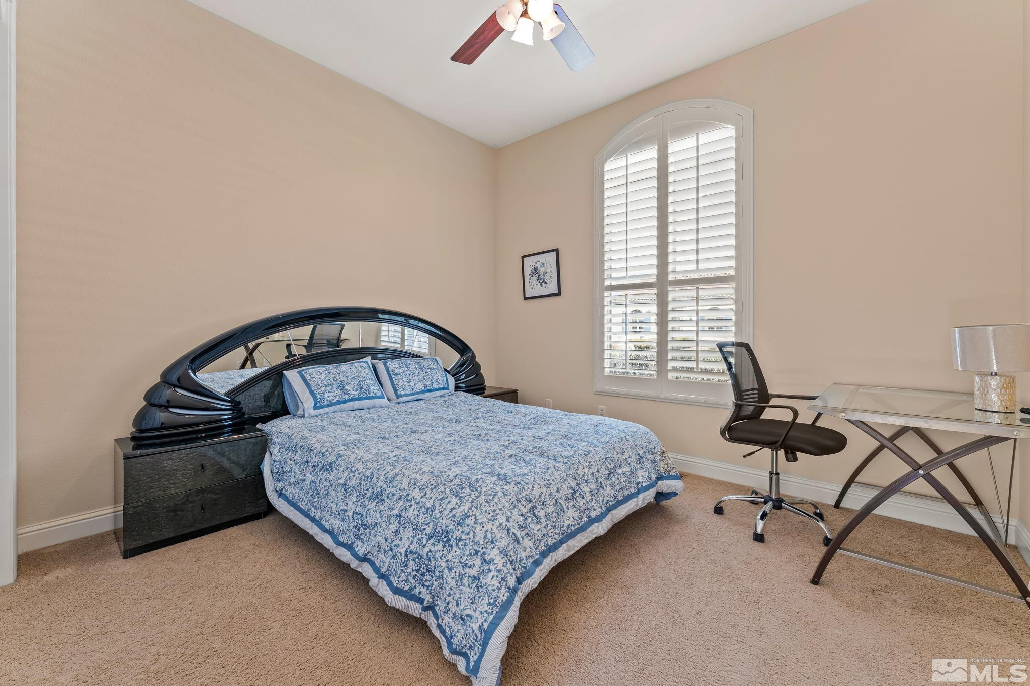 13395 Damonte View Lane Reno, NV 89511 - Photo 32 of 40 a bedroom with a bed and a chandelier