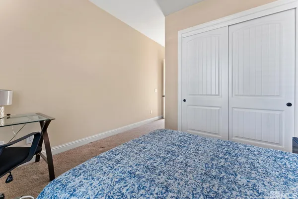 a bathroom with a sink a toilet and shower curtain