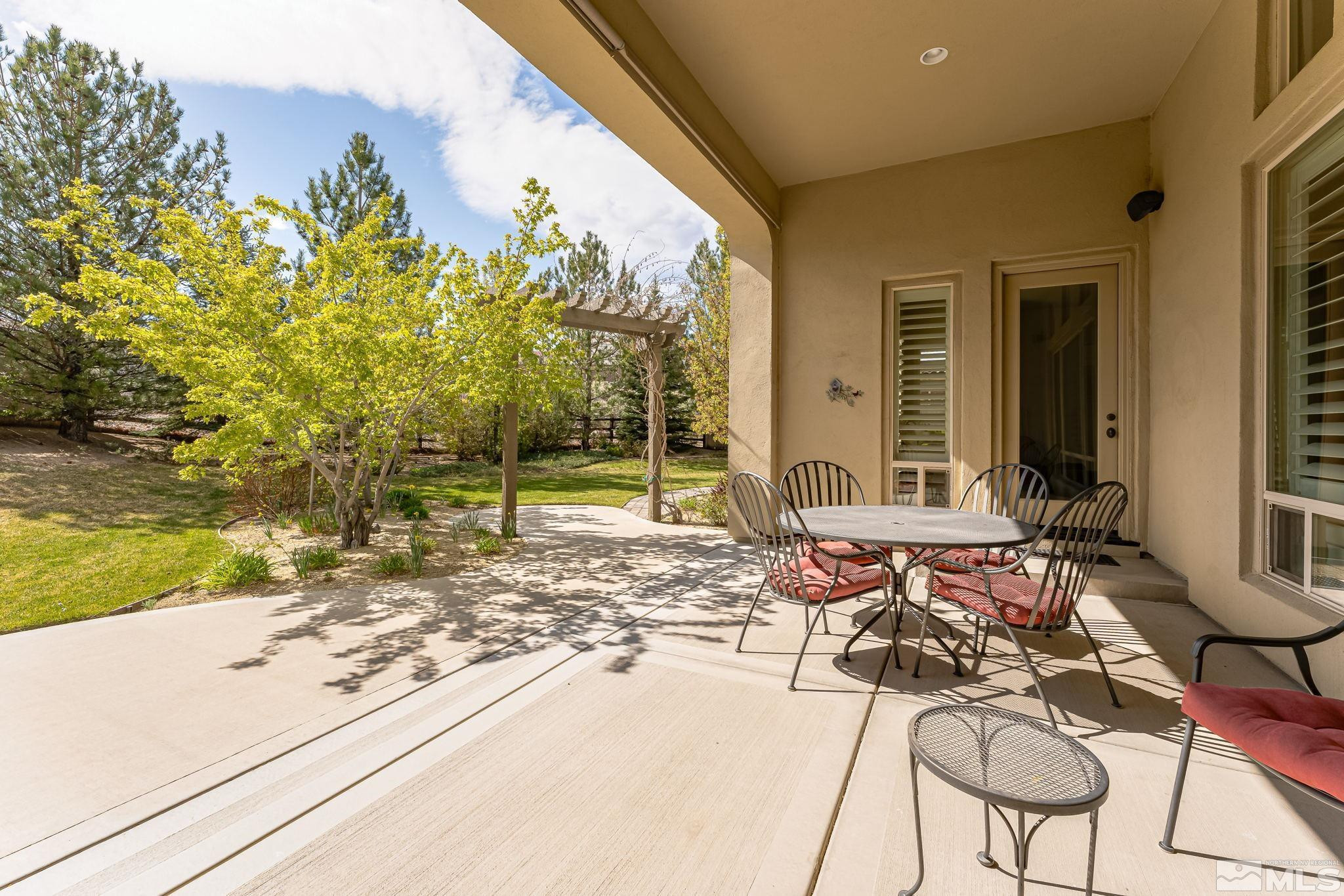 13395 Damonte View Lane Reno, NV 89511 - Photo 38 of 40 a view of a patio with table and chairs and potted plants