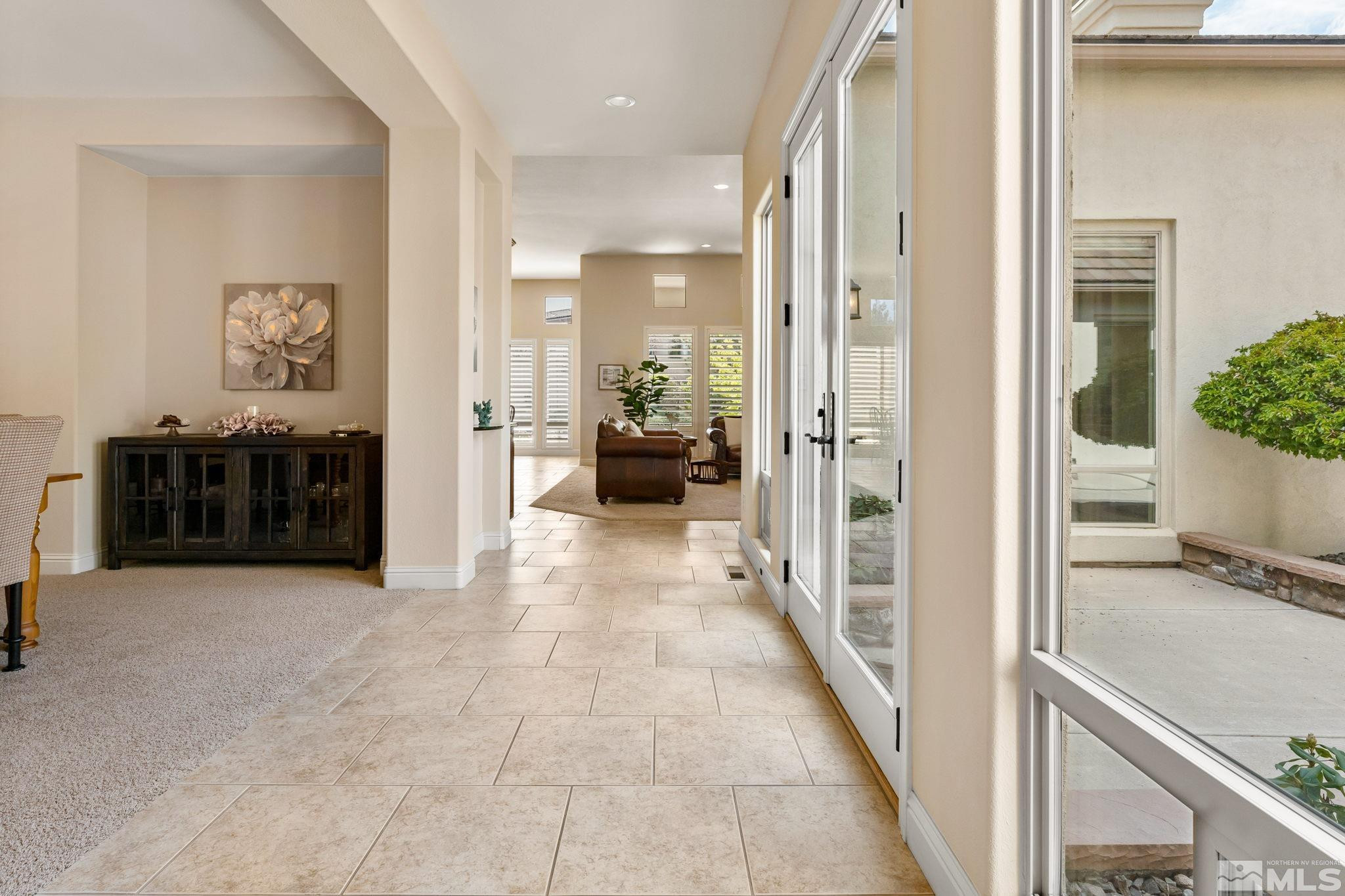 13395 Damonte View Lane Reno, NV 89511 - Photo 5 of 40 a view of a hallway with living room and furniture