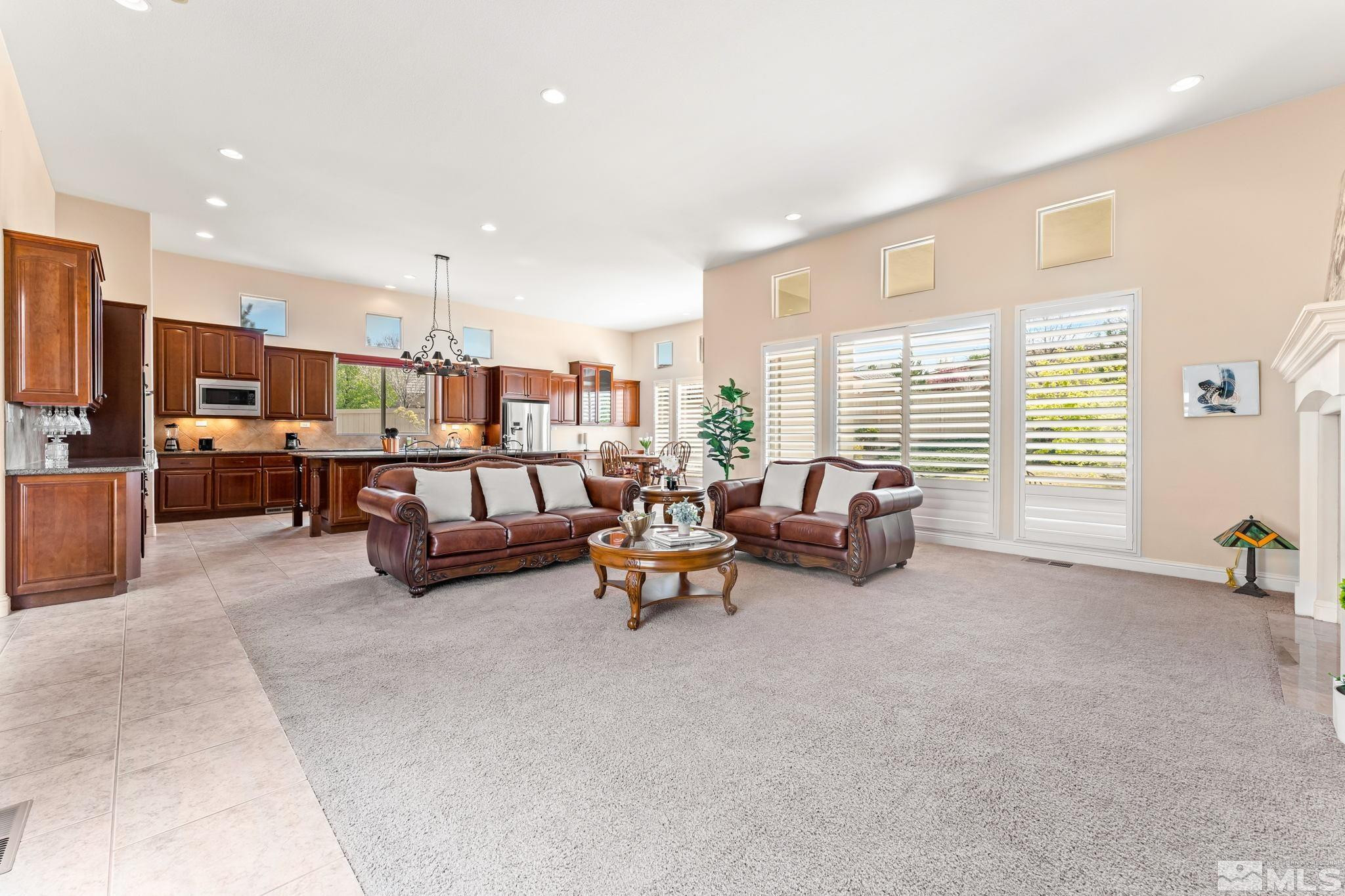 13395 Damonte View Lane Reno, NV 89511 - Photo 10 of 40 a living room with furniture kitchen view and a large window