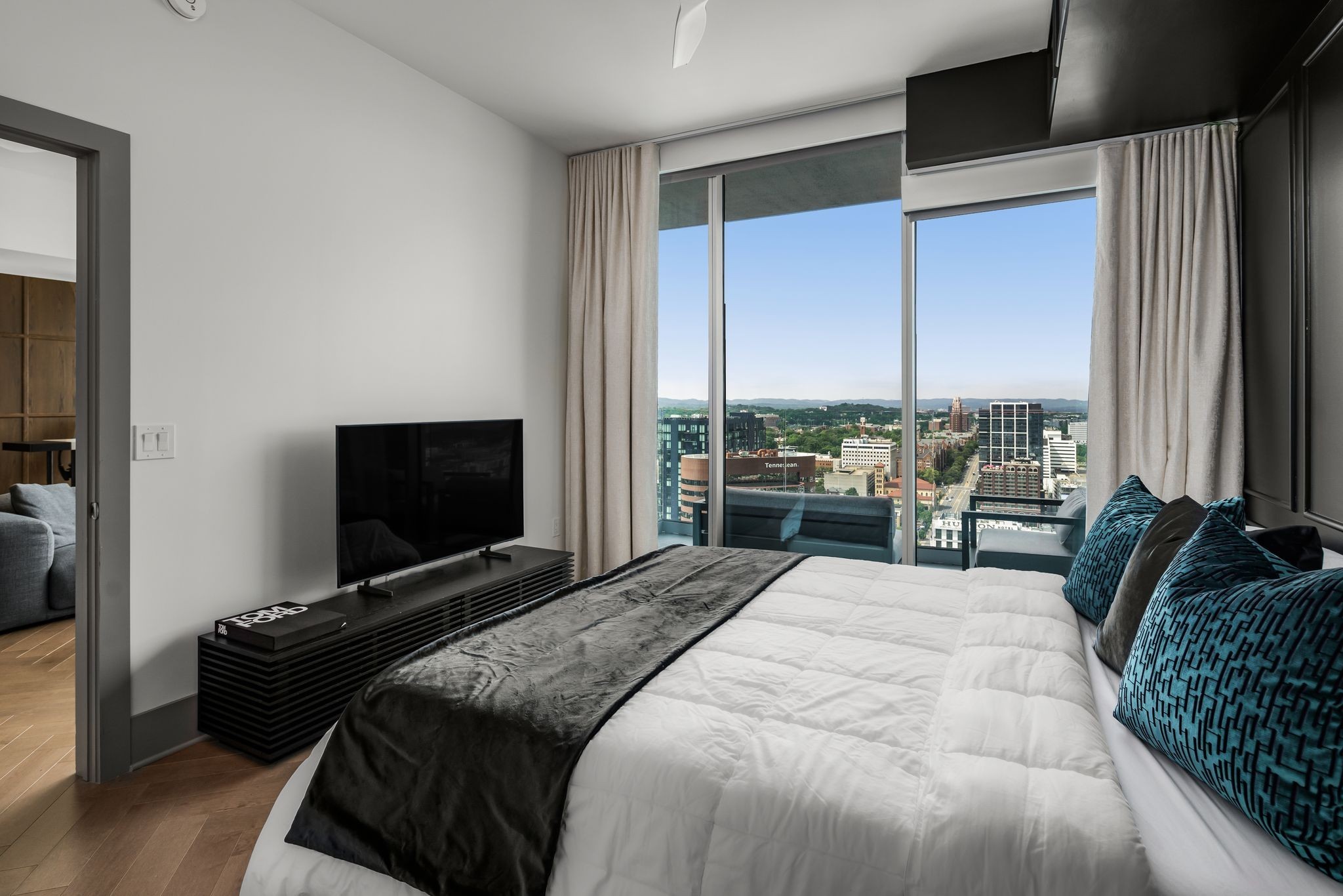 1616 West End Avenue, Unit 2609 Nashville, TN 37203 - Photo 16 of 46 a bedroom with a bed and a television