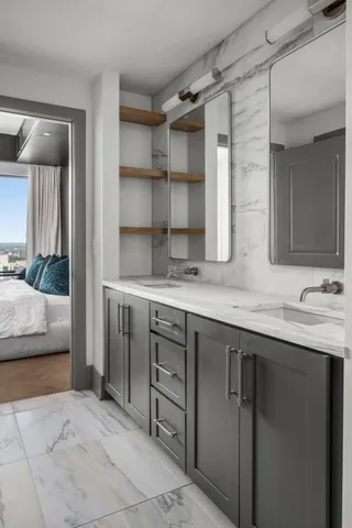 a bathroom with a sink and a large mirror