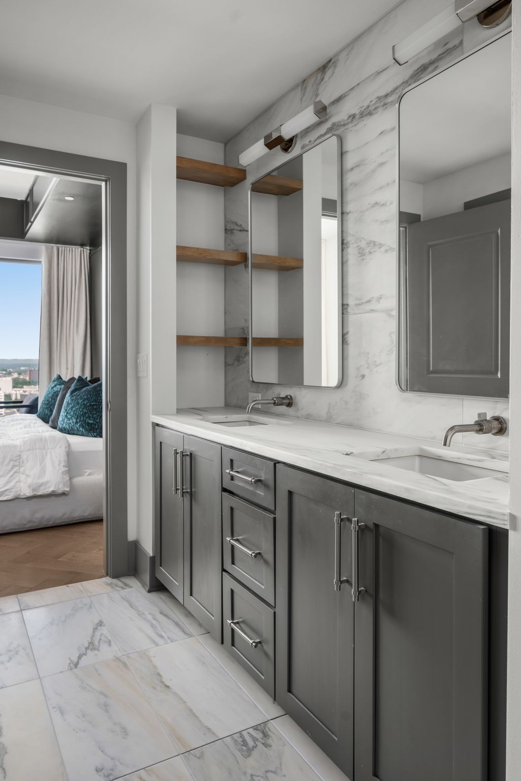 1616 West End Avenue, Unit 2609 Nashville, TN 37203 - Photo 18 of 46 a bathroom with a sink and a large mirror