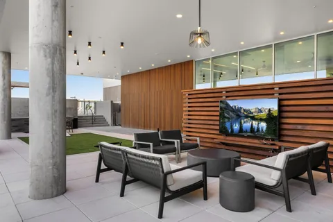 a living room with furniture and a large window