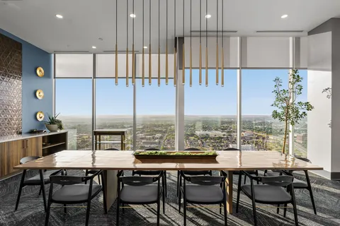 a large room with lots of potted plants