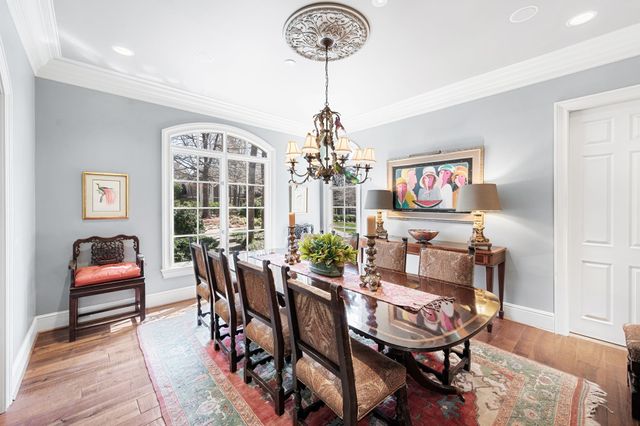 a large spacious bathroom with a large tub sink and mirror