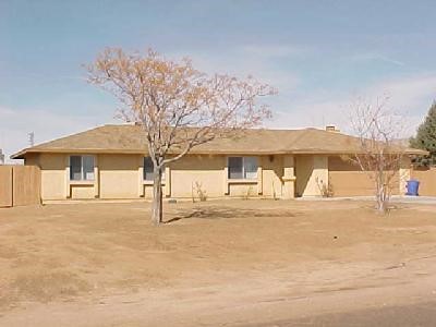 22194 Gayhead Road Apple Valley, CA 92307 - Photo 1 of 1 a view of a large white house with a snow on the road
