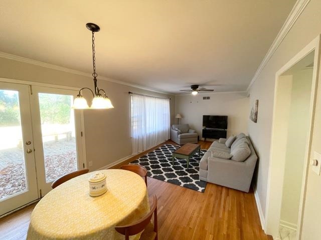 5200 Rich Road Memphis, TN 38117 - Photo 8 of 26 a living room with furniture and a wooden floor