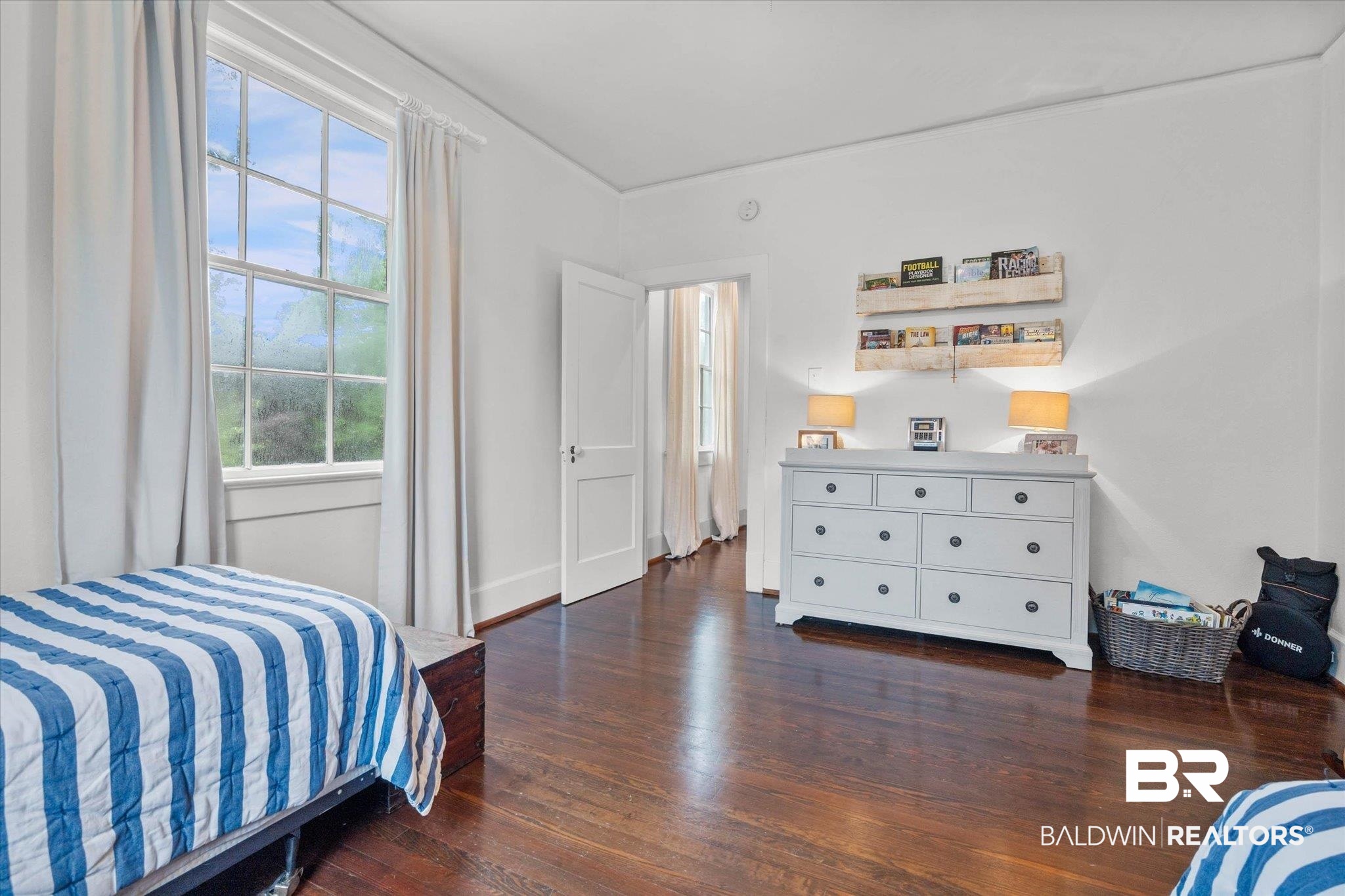 3863 Old Shell Road Mobile, AL 36608 - Photo 28 of 48 Spacious room featuring hardwood flooring, white walls, and a large multi-pane window
