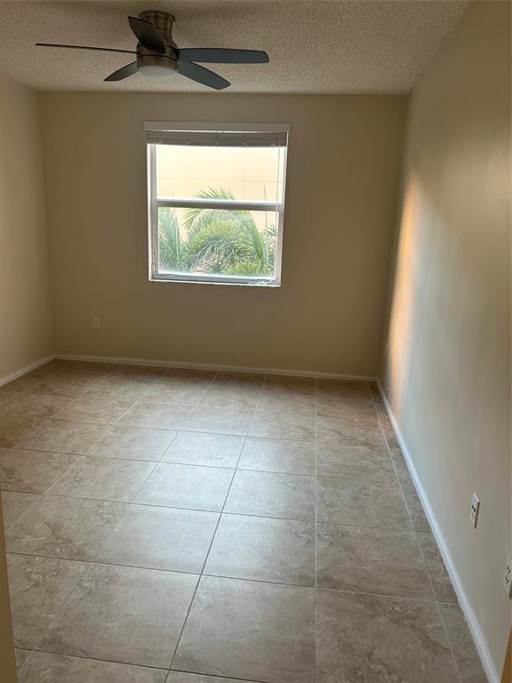 17150 North Bay Road, Unit 2519 Sunny Isles Beach, FL 33160 - Photo 7 of 9 an empty room with a window