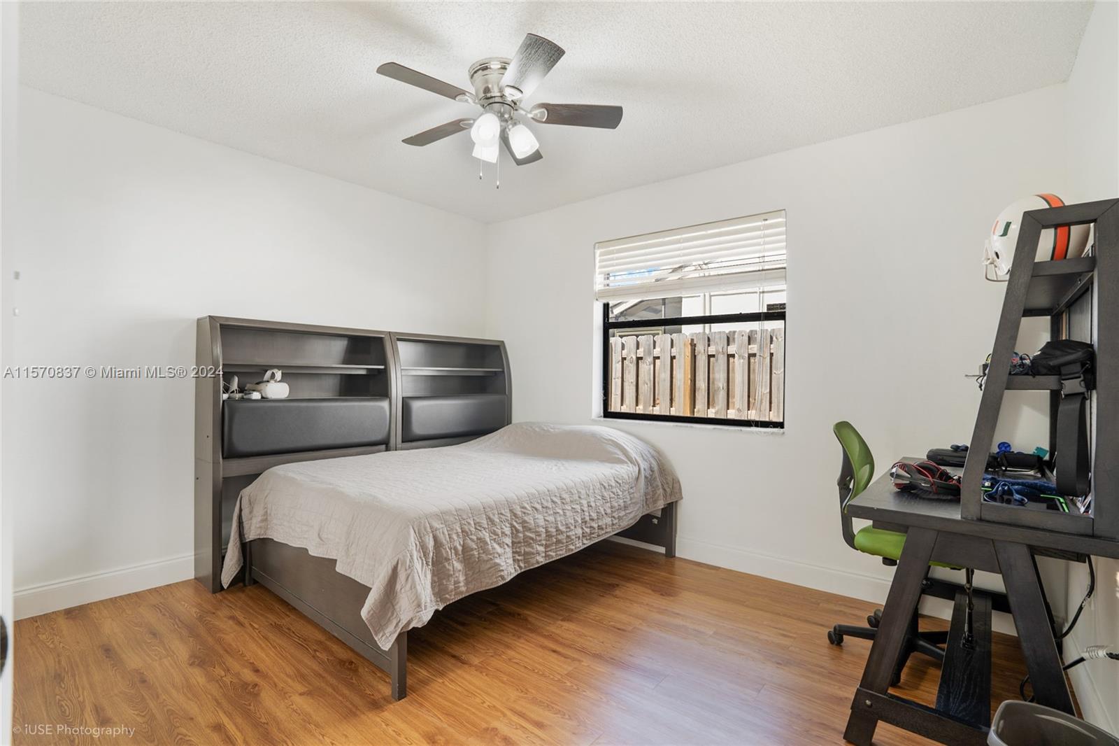 15440 Gauntlet Hall Manor Davie, FL 33331 - Photo 13 of 18 a bedroom with a bed and a bookshelf