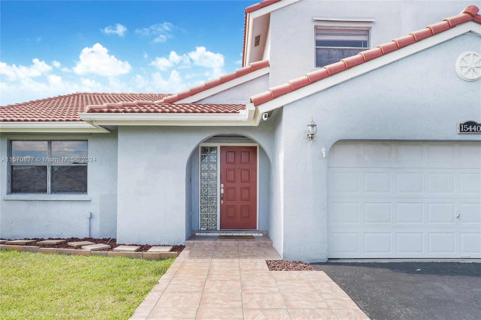 15440 Gauntlet Hall Manor Davie, FL 33331 - Photo 2 of 18 a front view of a house