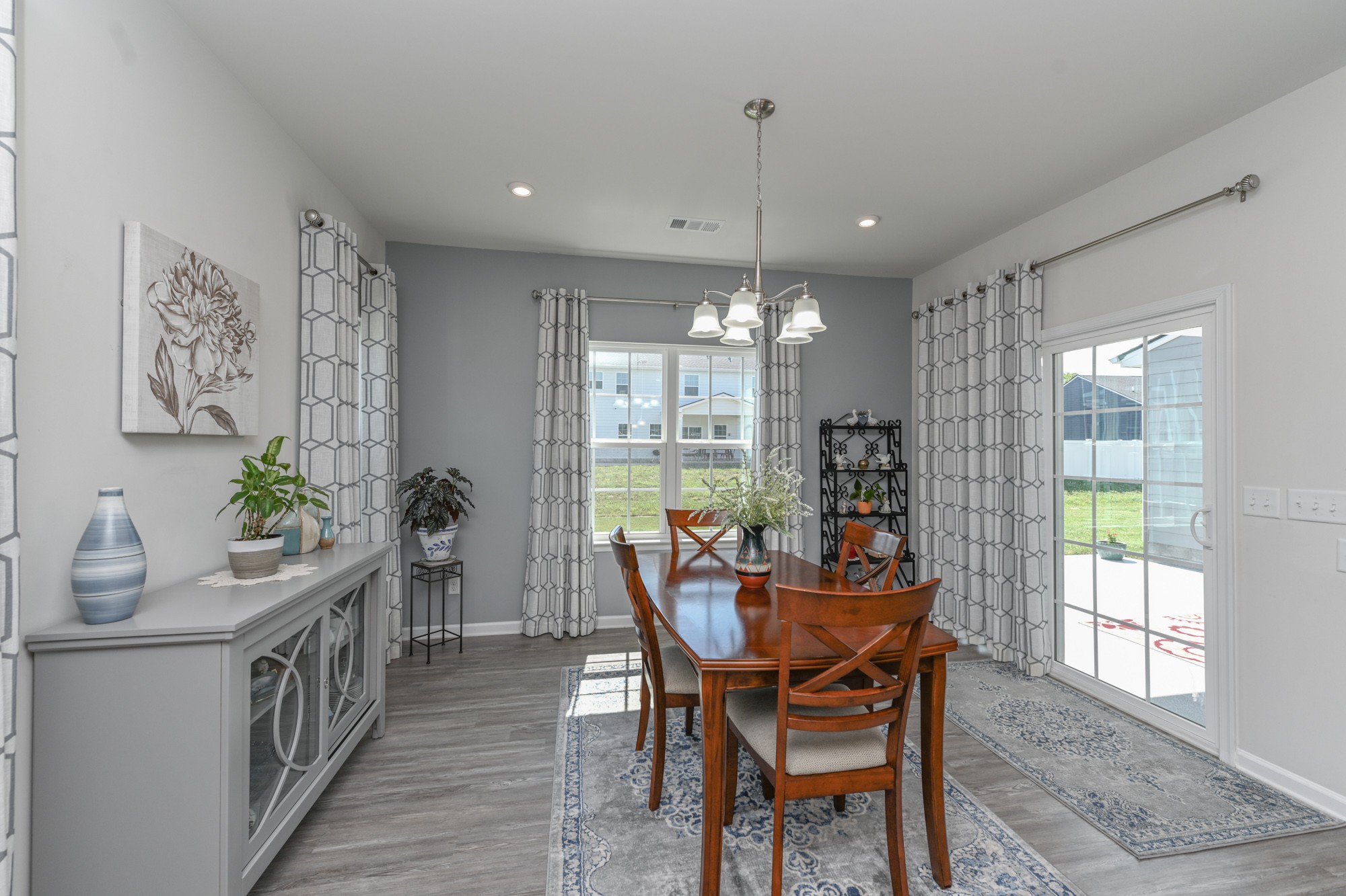 2907 Kellner Drive Murfreesboro, TN 37128 - Photo 15 of 33 a dining room with furniture a chandelier and wooden floor