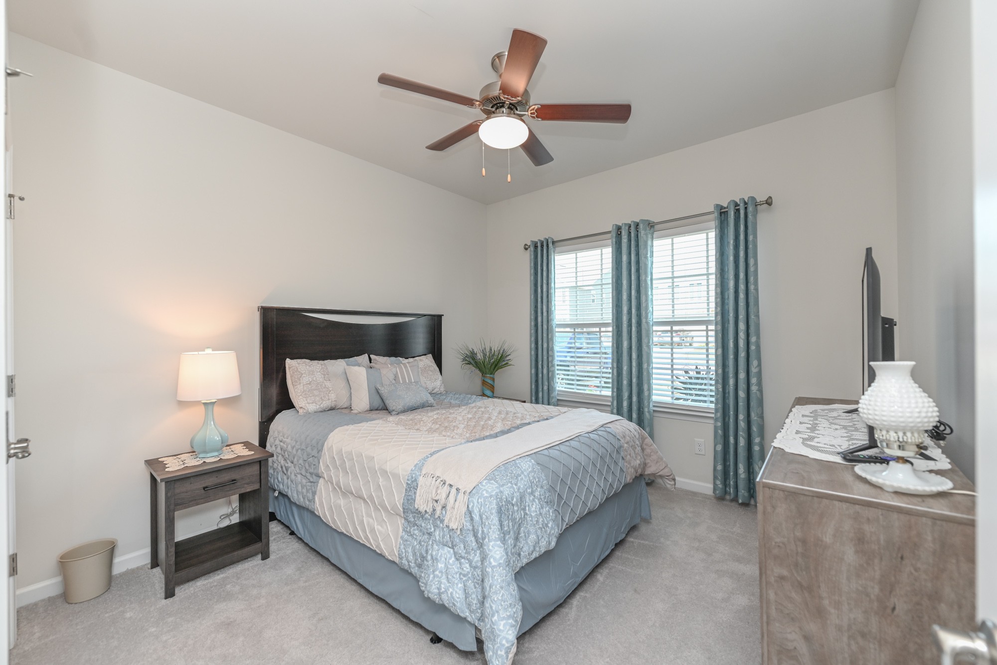 2907 Kellner Drive Murfreesboro, TN 37128 - Photo 22 of 33 a bedroom with a large bed and a chandelier fan