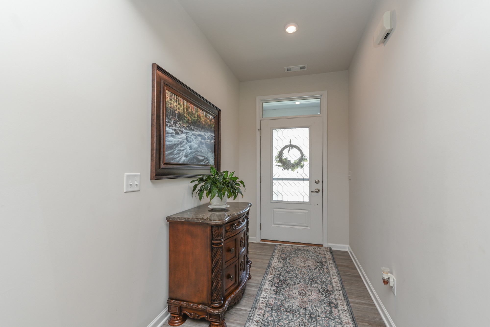 2907 Kellner Drive Murfreesboro, TN 37128 - Photo 3 of 33 an entryway with wooden floor and windows