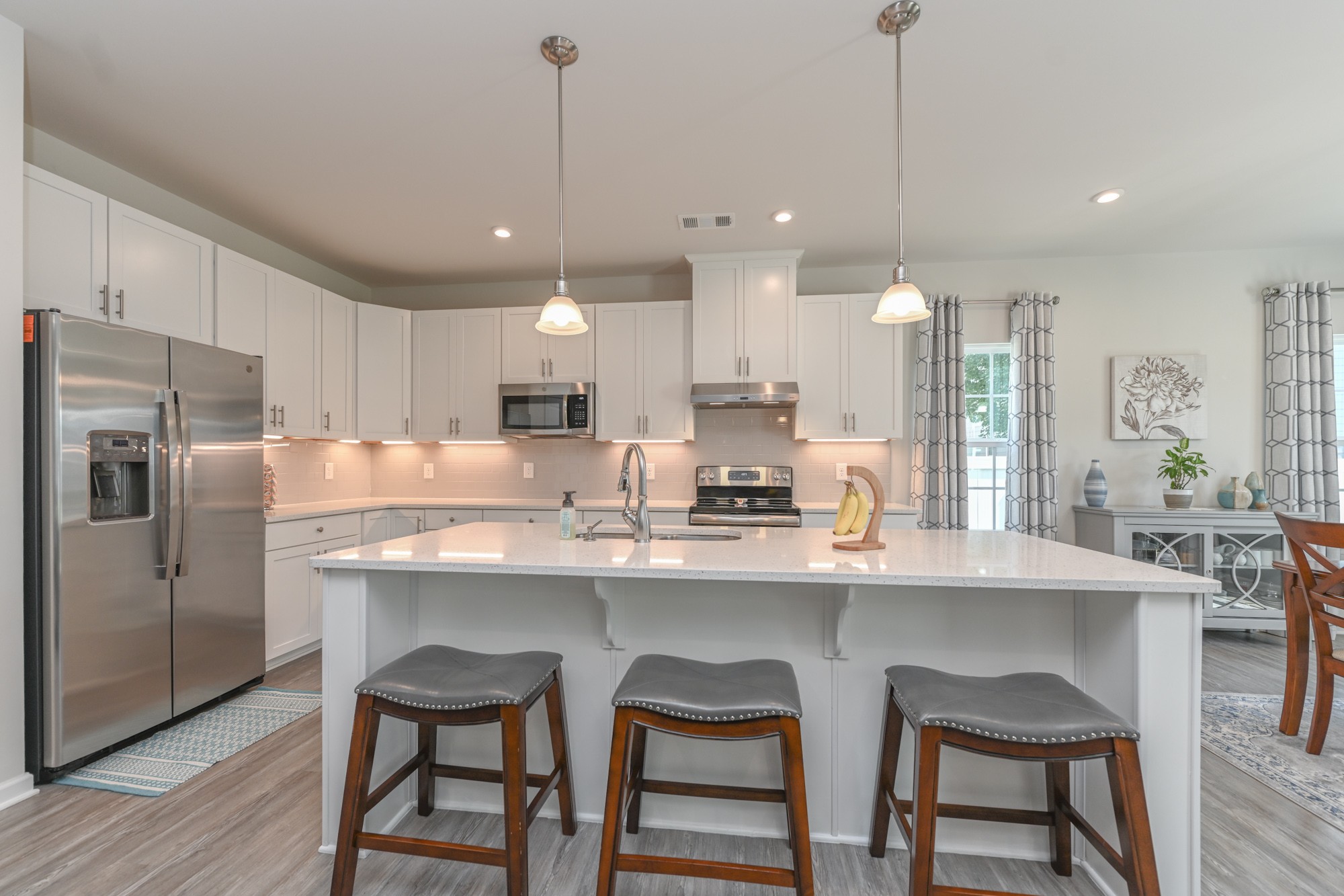 2907 Kellner Drive Murfreesboro, TN 37128 - Photo 10 of 33 a kitchen with stainless steel appliances granite countertop a sink a stove a refrigerator and chairs
