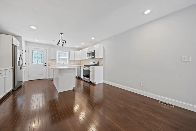 a view of kitchen with wooden floor