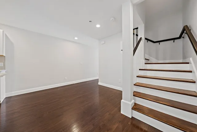 a view of entryway with wooden floor