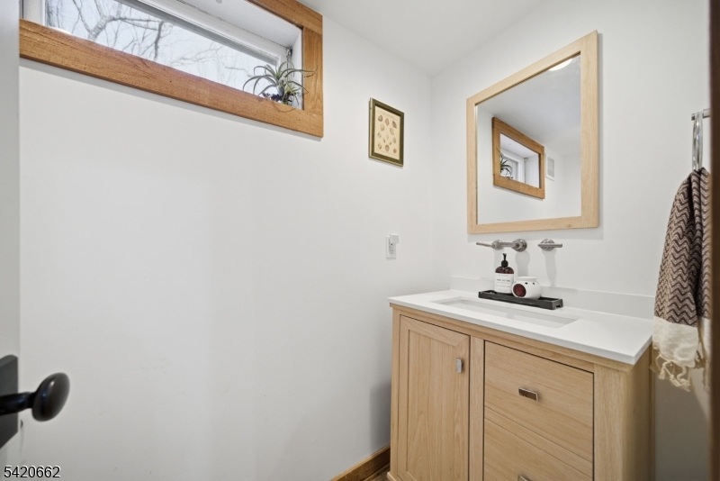 109 Taylortown Road Montville, NJ 07005 - Photo 21 of 50 a bathroom with a sink and a mirror