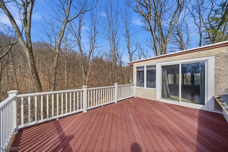 109 Taylortown Road Montville, NJ 07005 - Photo 31 of 50 a view of backyard with deck and wooden floor
