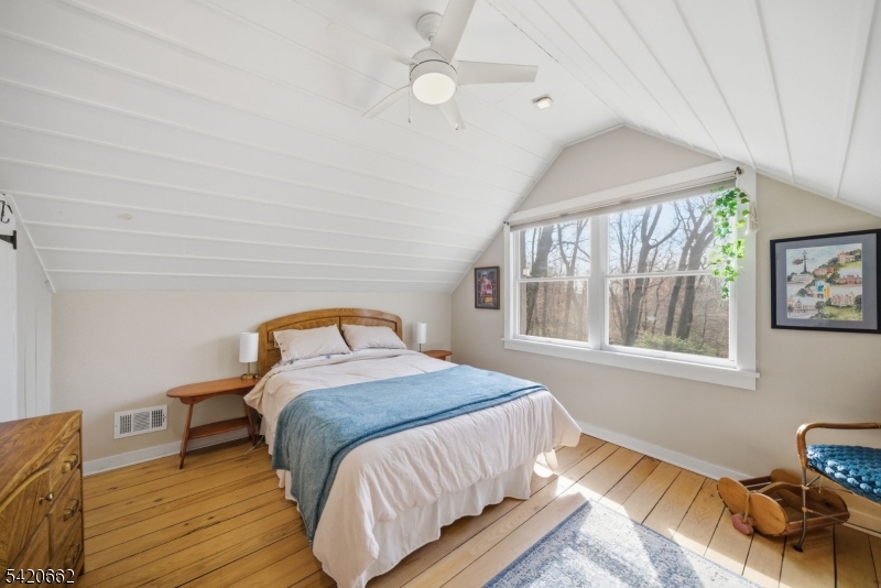 109 Taylortown Road Montville, NJ 07005 - Photo 32 of 50 a bedroom with a bed and wooden floor