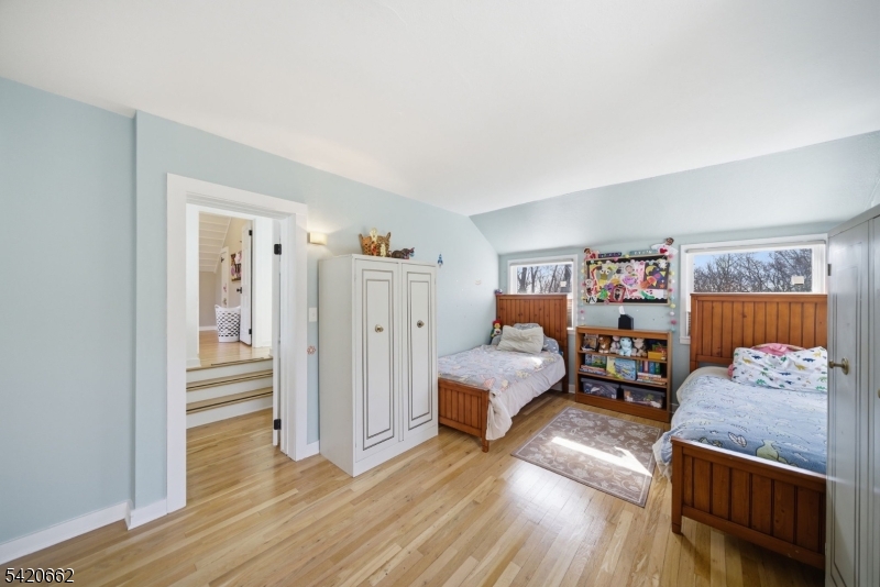 109 Taylortown Road Montville, NJ 07005 - Photo 36 of 50 a bedroom with furniture and wooden floor