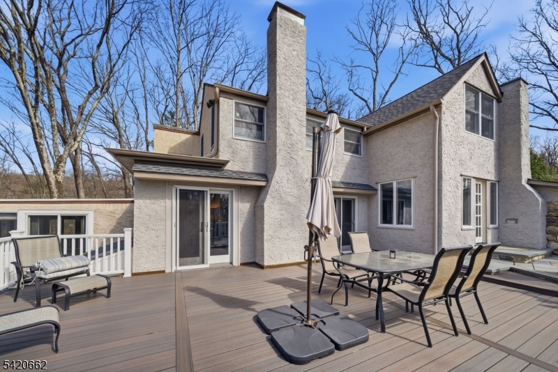 109 Taylortown Road Montville, NJ 07005 - Photo 39 of 50 a view of a patio with table and chairs with wooden floor and fence