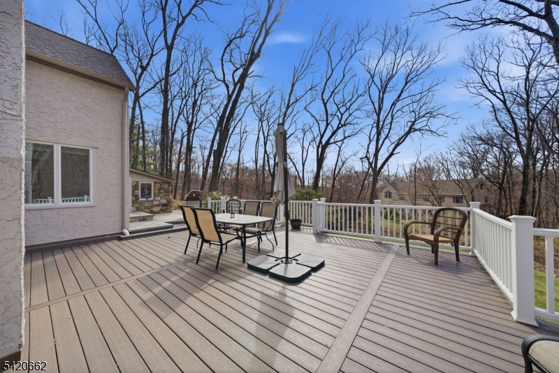 109 Taylortown Road Montville, NJ 07005 - Photo 40 of 50 a view of house with deck outdoor seating and trees in the background