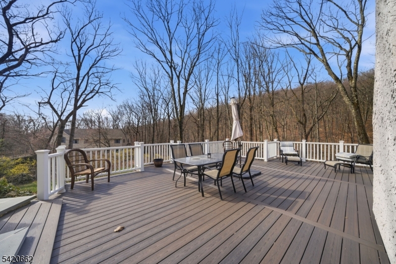 109 Taylortown Road Montville, NJ 07005 - Photo 41 of 50 a view of a deck with table and chairs and wooden floor