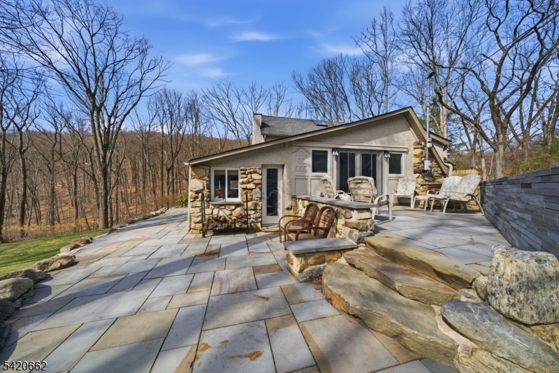109 Taylortown Road Montville, NJ 07005 - Photo 45 of 50 a view of a patio with dining table and chairs with wooden fence